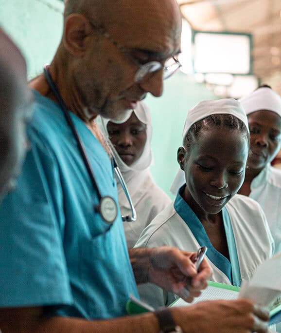 Doctor Tom Helping Nurses.