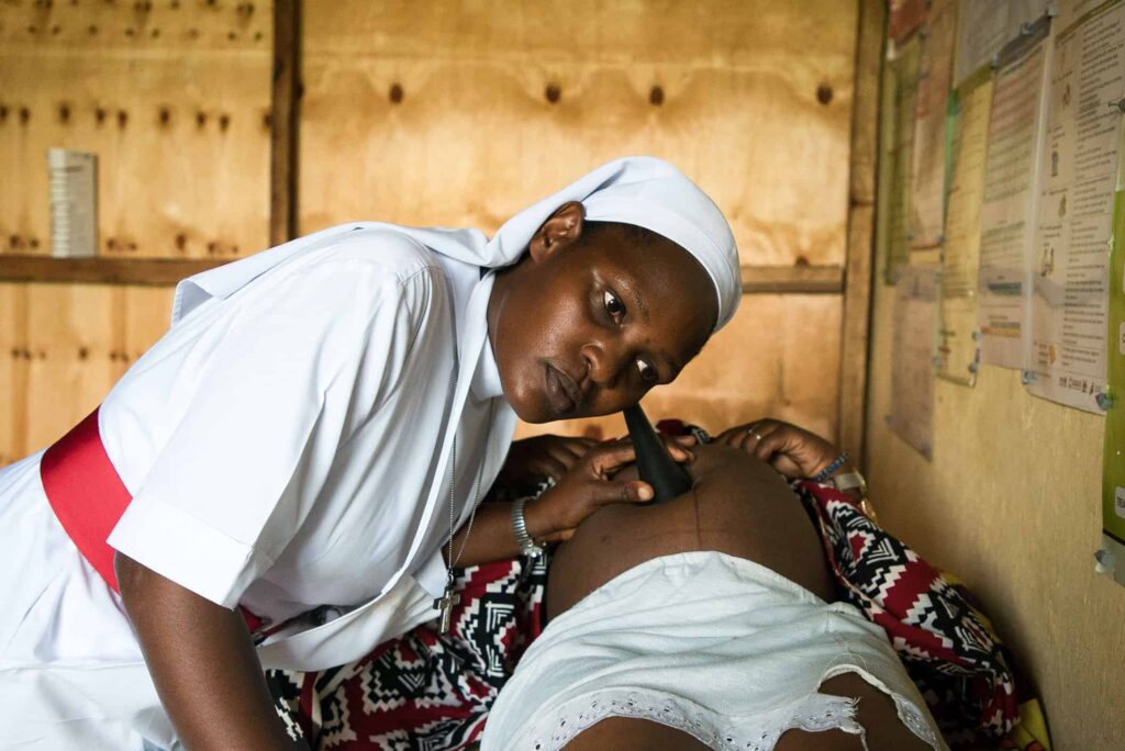 A nurse checking a patient