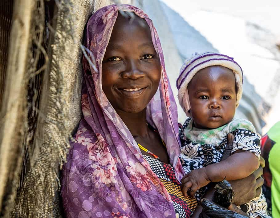 mother and her child smiling.