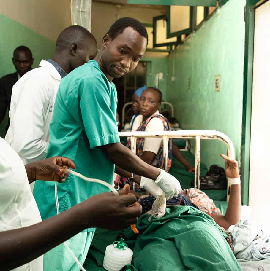 Image of a doctor drawing patients blood.