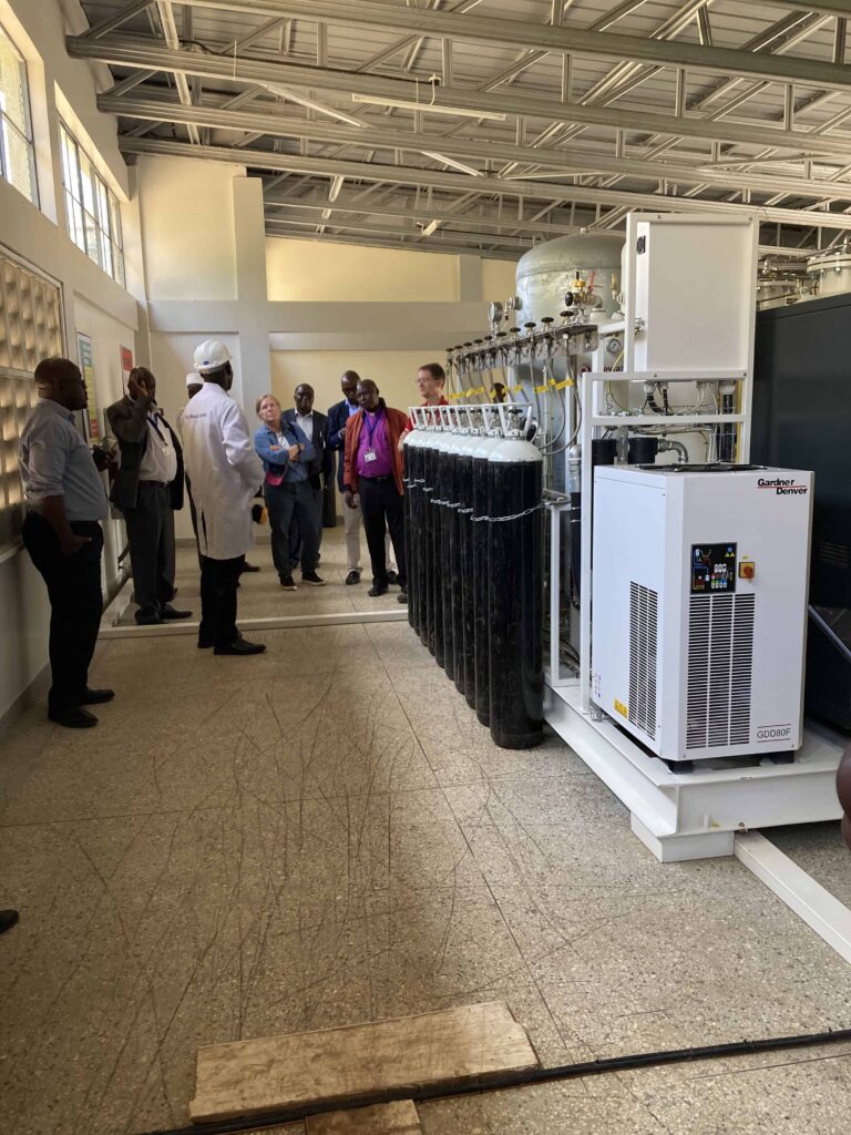 A tour group looking at a set of large oxygen tanks used by 02 Africa