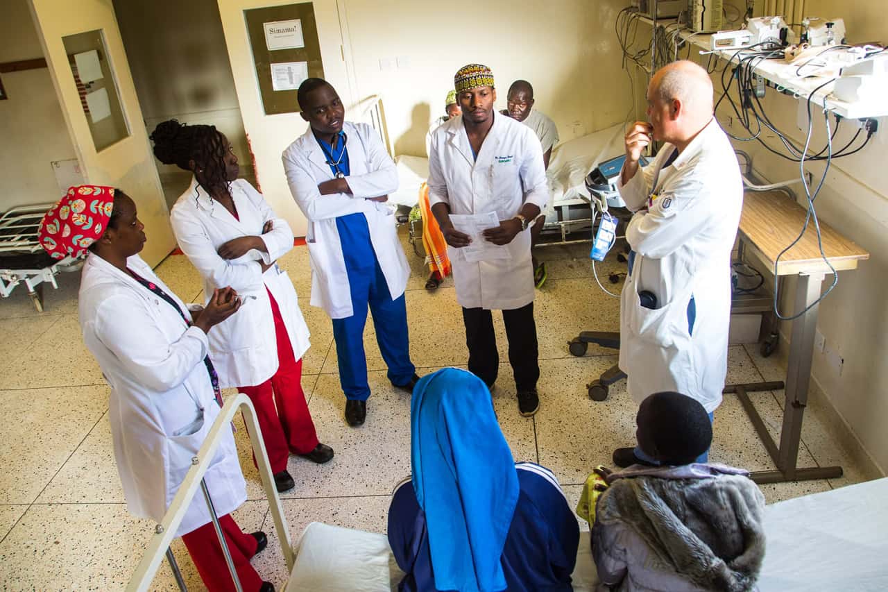 A group of doctors talking with them patients