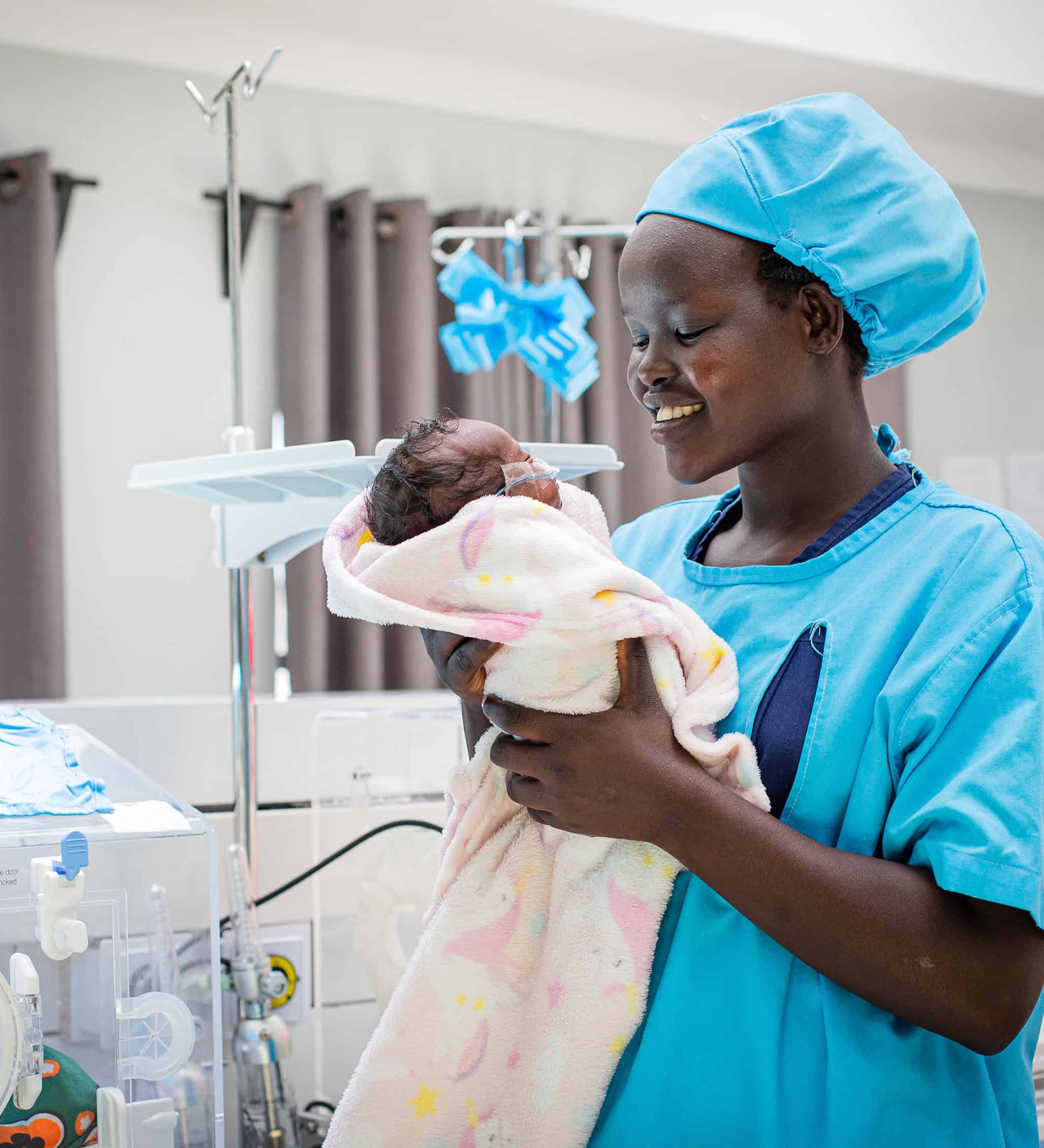 A nurse holding a baby