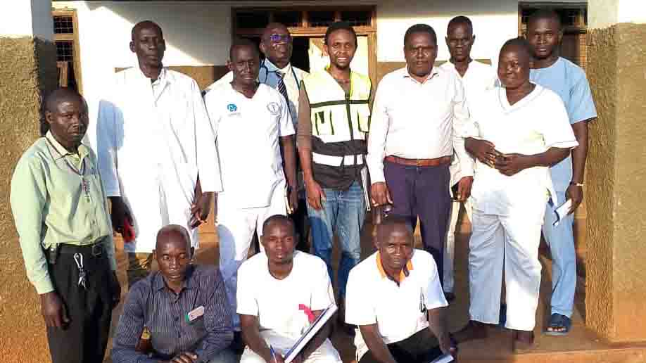Hospital staff and African Mission Healthcare biomedical support team at St. Theresa Mission Hospital in Nzara