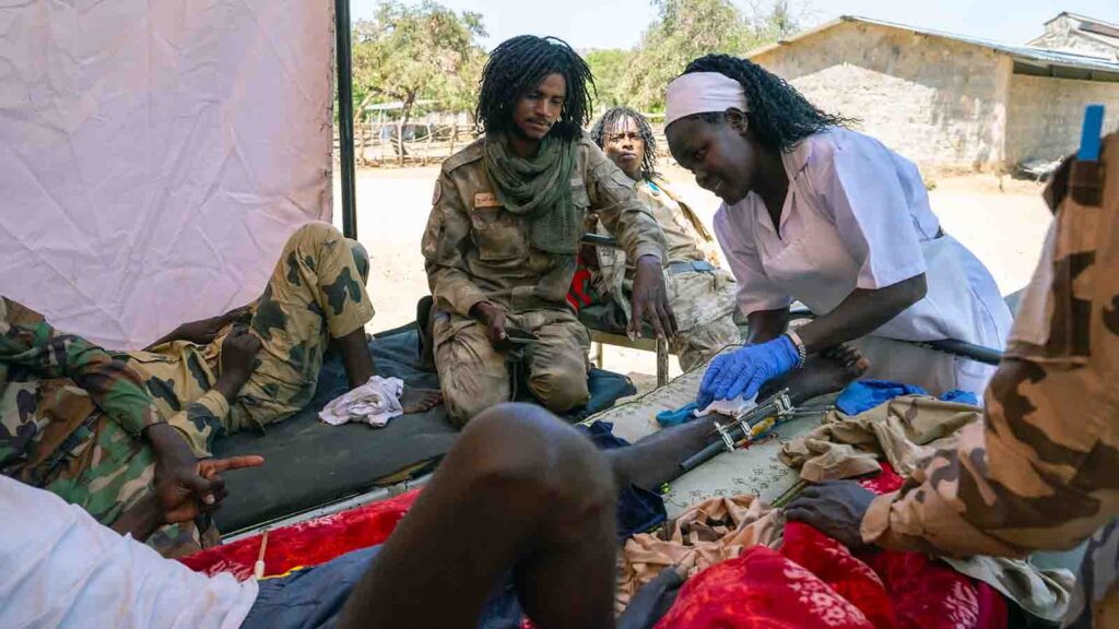 Soldier with leg wound, Nuba