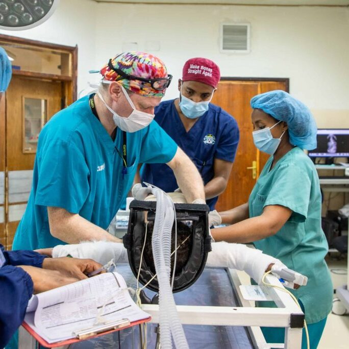 A group of doctors performing a surgery